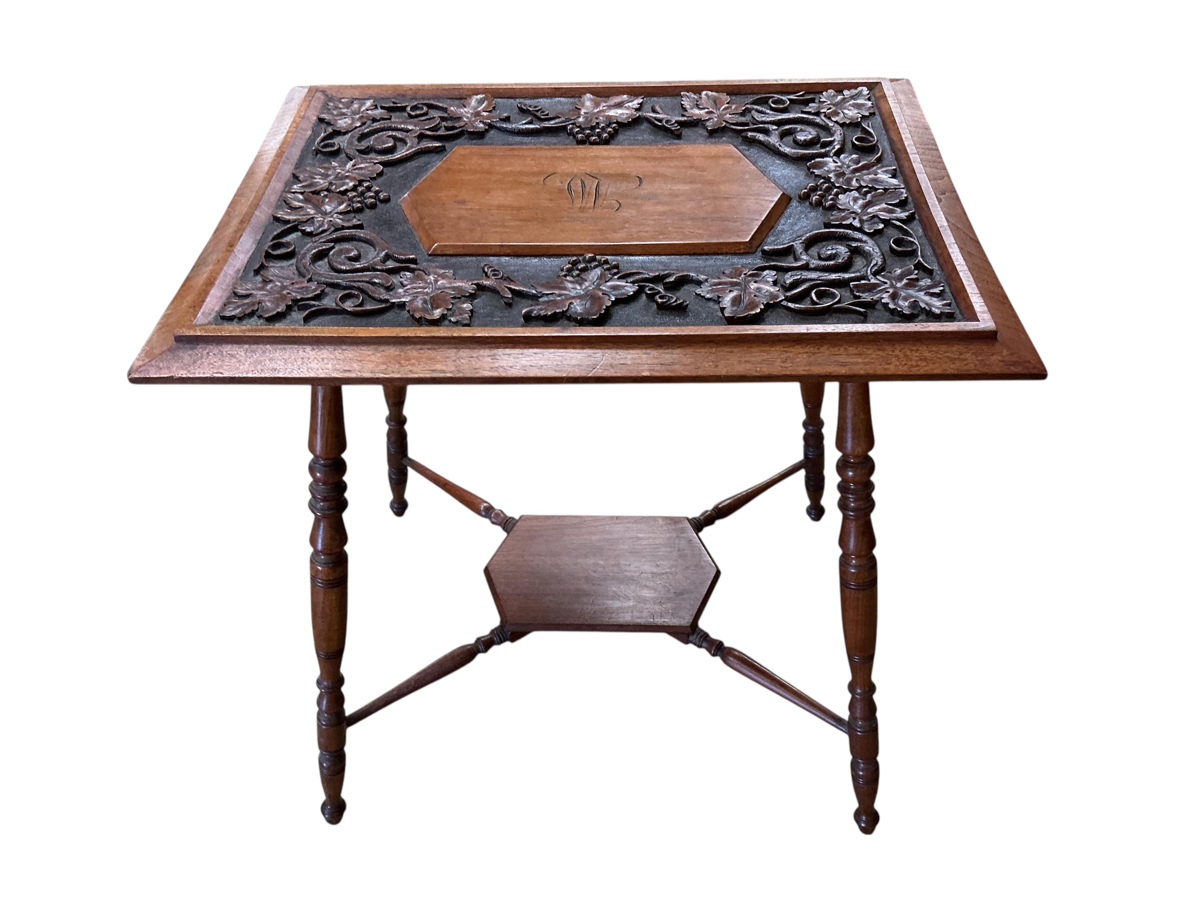 A late Victorian rectangular carved oak occasional table, decorated with vines, width 66cm, depth 49cm, height 67cm